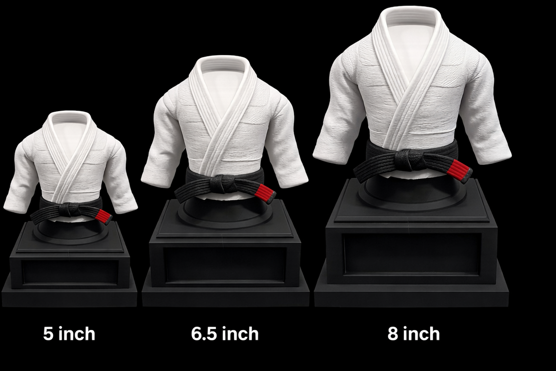Set of four white martial arts uniforms on black stands with size labels below.